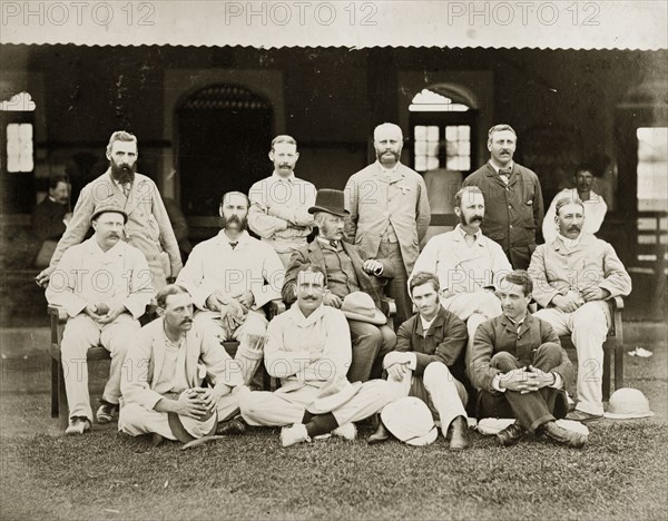 Members of the south Bombay cricket team. Members of the south Bombay cricket team pose outside a clubhouse dressed in their whites. Bombay (Mumbai), India, circa 1875. Mumbai, Maharashtra, India, Southern Asia, Asia.