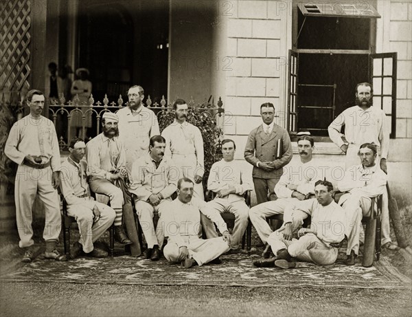 Members of the north Bombay cricket team. Members of the north Bombay cricket team pose for a group portrait outside a colonial-style buidling, possibly a clubhouse. Bombay (Mumbai), India, circa 1875. Mumbai, Maharashtra, India, Southern Asia, Asia.