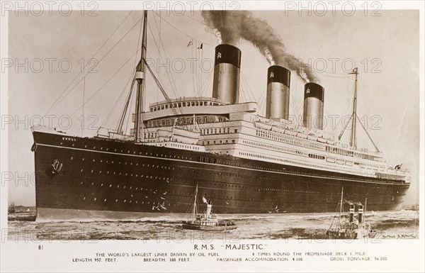RMS Majestic. Photographic postcard of the RMS Majestic sailing on the open sea. The luxury liner was 957 feet (292 metres) long boasted a capacity of 4,100 passengers. Location unknown, circa 1925.