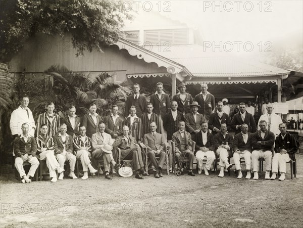 Calcutta Cricket Club. British members of the Calcutta Cricket Club line up for the camera in graduated rows. Several of the men are dressed in their cricket whites and striped blazers. Calcutta (Kolkata), India, circa 1925. Kolkata, West Bengal, India, Southern Asia, Asia.
