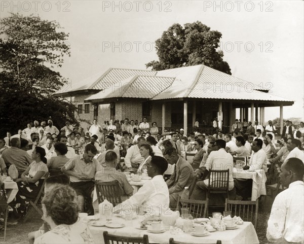 Guests at Rangoon Golf Club. Over 350 members and guests of the Rangoon Golf Club are seated around tables, listening to a speech being given by the club's Captain. Rangoon (Yangon), Burma (Myanmar), circa 1952. Yangon, Yangon, Burma (Myanmar), South East Asia, Asia.