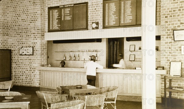 Rangoon Golf Club bar. The bar at the newly opened club house of the Rangoon Golf Club, facing out onto a veranda. Boards above the bar list winners of the Burma Championship and Captains of the club since 1909 when it first opened. Rangoon (Yangon), Burma (Myanmar), circa 1952. Yangon, Yangon, Burma (Myanmar), South East Asia, Asia.