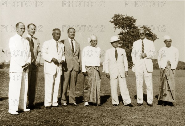 Rangoon Golf Club council. Outdoors group portrait of members on the Rangoon Golf Club council. Rangoon (Yangon), Burma (Myanmar), circa 1952. Yangon, Yangon, Burma (Myanmar), South East Asia, Asia.