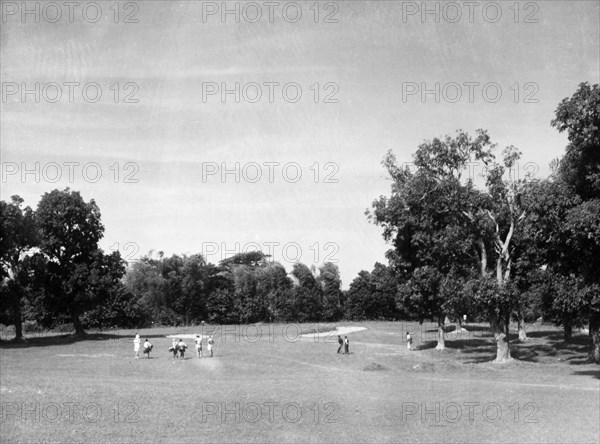 Golfers at Rangoon Golf Club. A group of golfers stroll to the next hole on the course at Rangoon Golf Club. Rangoon (Yangon), Burma (Myanmar), circa 1952. Yangon, Yangon, Burma (Myanmar), South East Asia, Asia.
