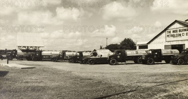 Indo-Burma Petroleum Company forecourt. Petrol tankers and company vehicles, parked on the forecourt of an Indo-Burma Petroleum Company station. Burma (Myanmar), circa 1942. Burma (Myanmar), South East Asia, Asia.