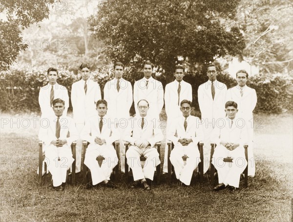 Prefects of the Royal College, Colombo. Prefects at the Royal College of Colombo, a leading public school in Ceylon (Sri Lanka), pose for a group portrait with College Principal, Edward Lawrence Bradby, during the academic year 1943-44. Two of the students pictured, L.C. Arulpragasam and C.L. Wickremesinghe were both editors of the school's magazine and accordingly became head prefects. Colombo, Ceylon (Sri Lanka), 13 November 1944. Colombo, West (Sri Lanka), Sri Lanka, Southern Asia, Asia.