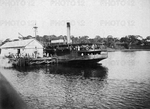 SS Usoga at Port Bell. Passengers board the SS Usoga at Port Bell on Lake Victoria. The railway steamer ferry was one of several that serviced passengers using the Uganda Railway. Near Kampala, Uganda, circa 1913. Kampala, Central (Uganda), Uganda, Eastern Africa, Africa.