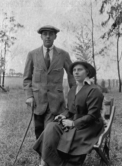 Charles Bungey and his wife. Charles Bungey and his wife dressed in outdoors clothes. Charles Bungey was a training officer with the Public Works Department in the East Africa Protectorate from about 1910 until the 1930s. His wife accompanied him in Kenya for most of these years. British East Africa (Kenya), 1916., Nairobi Area, Kenya, Eastern Africa, Africa.