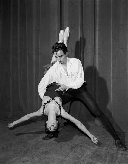 Nicholas Polajenko and Daphne Dale. Dancer Nicholas Polajenko lifts Daphne Dale during a ballet routine. Both dancers wear traditional ballet costumes. Kenya, 28 October 1955. Kenya, Eastern Africa, Africa.