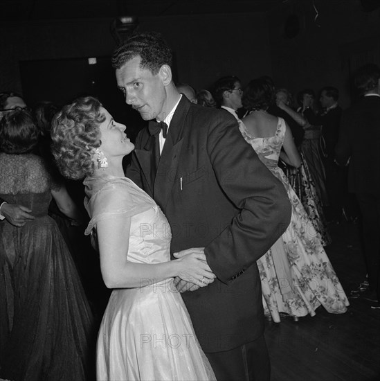 On the dancefloor at the SJAK dance. A couple touch hands on the dance floor at an event held for the Sports Journalists Association of Kenya (SJAK). Kenya, 19 August 1955. Kenya, Eastern Africa, Africa.