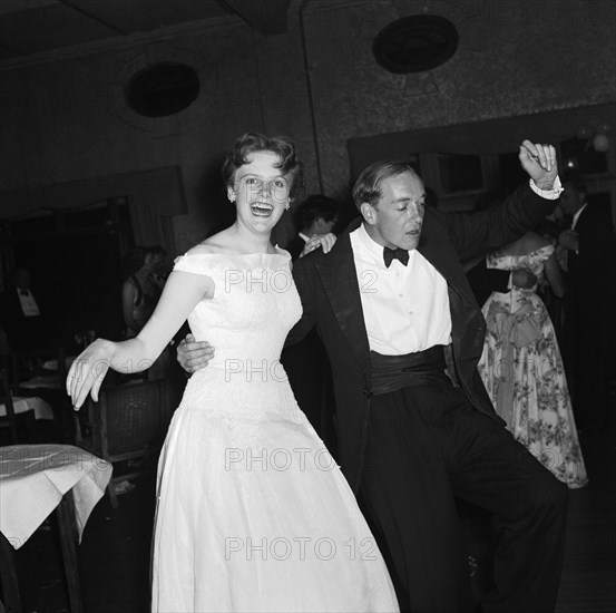 On the dancefloor at the SJAK dance. A formally dressed couple enjoy themselves on the dance floor at a dance held for the Sports Journalists Association of Kenya (SJAK). Kenya, 19 August 1955. Kenya, Eastern Africa, Africa.