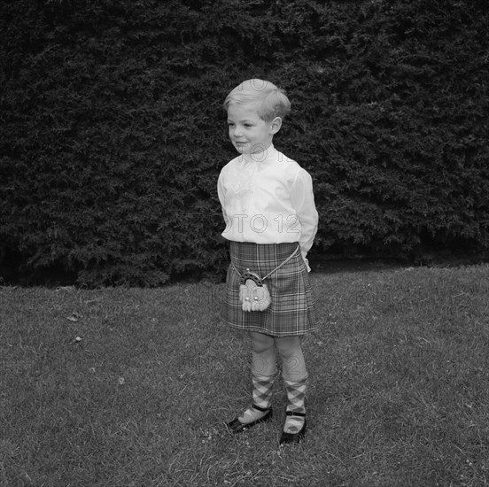 Neville Vincent's son. Portrait of Neville Vincent's young son wearing traditional Scottish dress consisting of a tartan kilt and socks worn with a sporran. Kenya, 28 August 1955. Kenya, Eastern Africa, Africa.