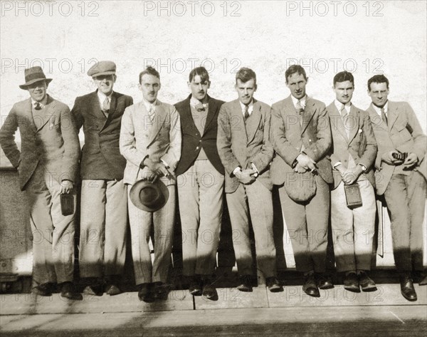 Sudan Political Service probationers. A group of European men, probationers in the Sudan Political Service, line up to have their photograph taken on the deck of SS Kemmendine. Sudan, November 1924. Sudan, Eastern Africa, Africa.