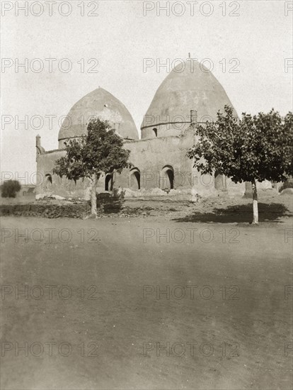 The Sheik's tomb'. A double-domed building with arched doorways and windows, captioned as the 'Sheik's tomb'. Khartoum, Sudan, circa 1925. Khartoum, Khartoum, Sudan, Eastern Africa, Africa.