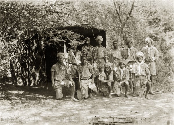 African scout group. A group of young African men at a scout camp. Each wears a uniform consisting of short trousers, a shirt and neckscarf. Sinkat, Sudan, 1926. Sinkat, Red Sea, Sudan, Eastern Africa, Africa.