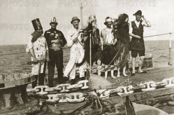 Crossing the line'. Crew members dressed in costume as King Neptune and his court for a 'crossing the line' naval initiation ceremony aboard HMS Delhi. Atlantic Ocean south of Sierra Leone, 14-22 December 1923., Western Africa, Africa.