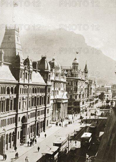 Adderley Street, Cape Town. View of Adderley Street, a main road through the city of Cape Town, dotted with pedestrians and trams, and flanked by tall buildings. Cape Town, Cape Province (West Cape), South Africa, 22-29 December 1923. Cape Town, West Cape, South Africa, Southern Africa, Africa.