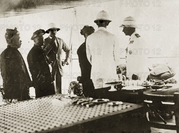 Sir Hubert Brand meets Malaysian leaders. Rear Admiral Sir Hubert Brand, a commander of the First Light Cruiser Squadron, meets Malaysian leaders, the Sultan of Kedah and the Rajah of Perlis aboard HMS Delhi. Pacific Ocean near British Malaya (Malaysia), 4-18 February 1924. Malaysia, South East Asia, Asia.