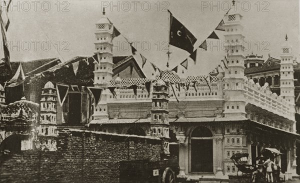 Singapore mosque. Strings of flags decorate an Indian-style mosque in the centre of town. Singapore, Straits Settlements (Singapore), 10-18 February 1924. Singapore, Central (Singapore), Singapore, South East Asia, Asia.