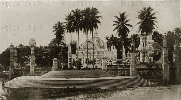 Malaysian mosque. Steps lead up to a decorative, domed mosque surrounded by palm trees. Singapore, Straits Settlements (Singapore), 10-18 February 1924. Singapore, Central (Singapore), Singapore, South East Asia, Asia.