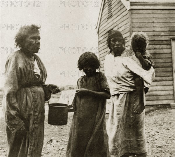 Tarcoola aborigines. Portrait of three female aborigines with a young child taken in the Tarcoola district. Perth, Australia, 27 February-1 March 1924. Perth, West Australia, Australia, Australia, Oceania.