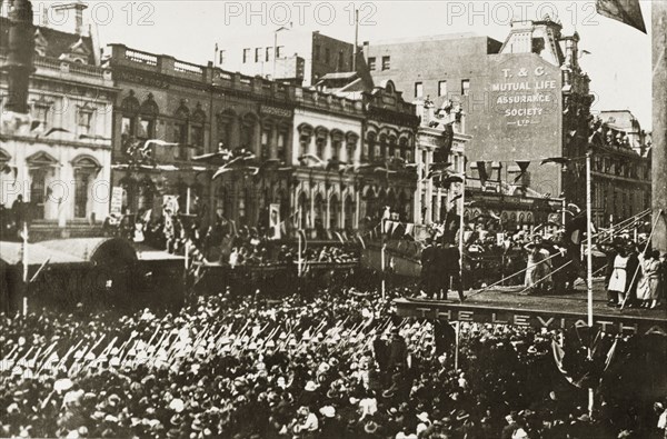 British Special Service Squadron parade. A procession of men from the British Special Service Squadron squeezes its way down Bourke Street through tightly packed crowds. Bunting festoons the road and onlookers watch from every available window and rooftop. Melbourne, Australia, 17-25 March 1924. Melbourne, Victoria, Australia, Australia, Oceania.