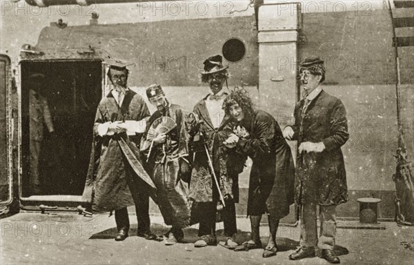 Comedians aboard HMS Hood. A group of comedians aboard HMS Hood dressed in a variety of character costumes. Pacific Ocean between Melbourne and Hobart, 25-27 March 1924., New South Wales, Australia, Australia, Oceania.