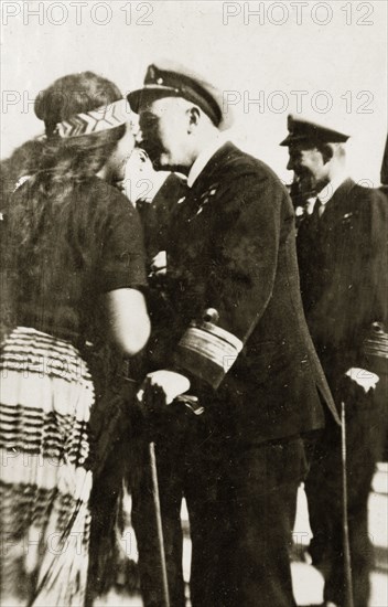 Rear Admiral Brand rubs noses. Rear Admiral Sir Hubert Brand greets a Maori woman by rubbing noses in traditional Maori fashion. Lyttleton, New Zealand, 1-8 May 1924. Lyttleton, Canterbury, New Zealand, New Zealand, Oceania.