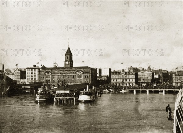 Auckland harbour. Crowds gather on the harbourside to watch the departure of the British Special Service Squadron. Auckland, New Zealand, 17 May 1924. Auckland, Auckland, New Zealand, New Zealand, Oceania.