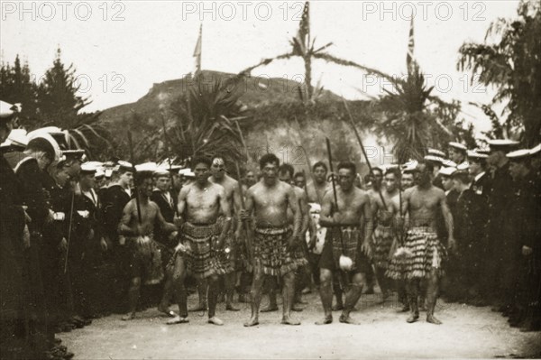 Fijian warriors. Male Fijian warriors perform a dance with spears wearing traditional beaded skirts on the arrival of the British Special Service Squadron. Fiji, 21-27 May 1924. Fiji, Pacific Ocean, Oceania.