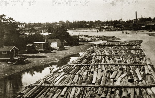 Canadian boomlogging. Logs contained by booms float on a Canadian river. British Colombia, Canada, 21 June-4 July 1924., British Columbia, Canada, North America, North America .