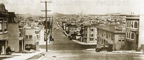 Taylor Street, San Francisco. Two and three storey buildings stretch away into the distance along a long empty road identified as 'Taylor Street'. San Francisco, United States of America, 7-11 July 1924. San Francisco, California, United States of America, North America, North America .