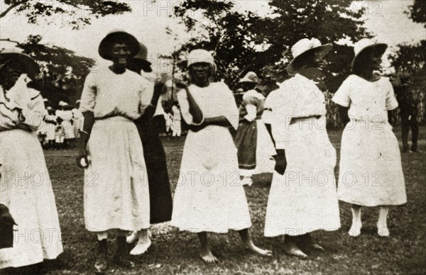Jamaican ladies. Portrait of a group of Jamaican women dressed in white wearing European-style clothes. Jamaica, 26-30 July 1924. Jamaica, Caribbean, North America .