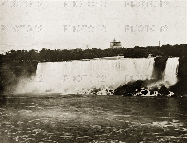 American Falls at Niagara. View from the Canadian side of the American Falls, one of the huge waterfalls comprising the Niagara Falls that are located on the border between the USA and Canada. Niagara, United States of America, 31 July-4 August 1924. Niagara Falls, New York, United States of America, North America, North America .