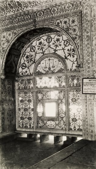 Scales of Justice' screen. An intricately carved marble screen in the Khas Mahal. The semi-circular panel of the screen depicts a crescent moon, stars and the scales of justice, the latter used as a regal emblem. The lower section is carved in a floral and lattice work design. Delhi, India, circa 1954. Delhi, Delhi, India, Southern Asia, Asia.
