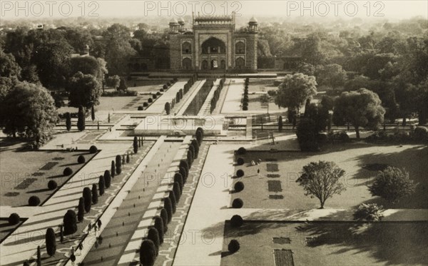 Gardens and gateway of the Taj Mahal. View of the formal 'charbagh' gardens at the Taj Mahal, leading towards the red sandstone gateway known as the Darwaza that forms the entrance to the complex. Agra, Uttar Pradesh, India, circa 1954. Agra, Uttar Pradesh, India, Southern Asia, Asia.
