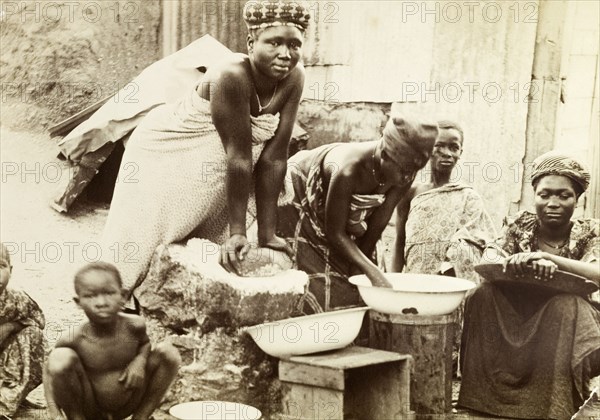 Making bread, Gold Coast. Gold Coast women making bread in a traditional manner. Salt Pond, Gold Coast (Ghana), 1918. Saltpond, West (Ghana), Ghana, Western Africa, Africa.
