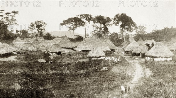 Panguma, Sierra Leone. A village scene depicting traditional thatched roof huts. Panguma, Sierra Leone, circa 1920. Panguma, South (Sierra Leone), Sierra Leone, Western Africa, Africa.