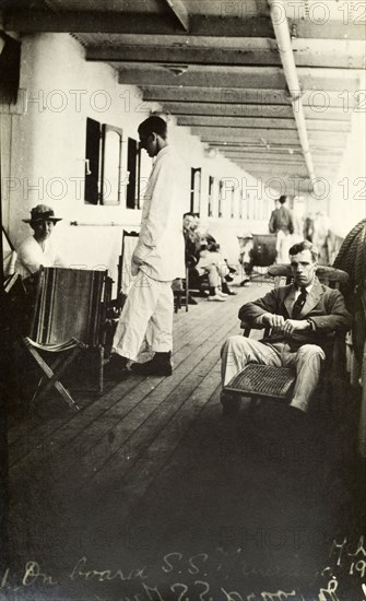 Tamlin en route to Africa. Mr Alfred Tamlin relaxes on the deck of an unidentified passenger ship en route to Africa. Location unknown, circa 1917.