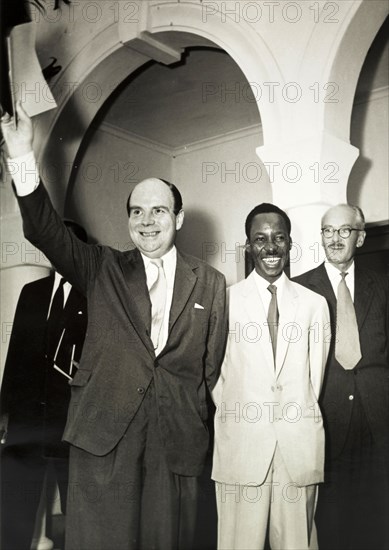 Nyerere after solemnising Tanzanian independence. Official publicity shot for the Tanganyikan government. Dr Julius Kambarage Nyerere smiles broadly as he emerges from a government office after signing official papers to solemnize Tanzanian independence. Tanganyika (Tanzania), 1961. Tanzania, Eastern Africa, Africa.