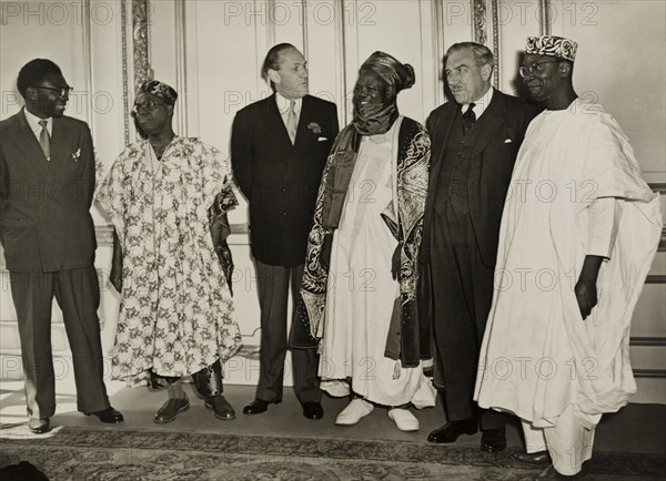 Delegates at the 1957 Lancaster House Conference. British and Nigerian delegates meet at the 1957 Lancaster House Conference, one of two meetings where the federal constitution for an independent Nigeria was prepared. The men are identified left to right as: the Nigerian High Commissioner in London, Chief Obafemi Awolowo (Premier of Western Nigeria), Alan Tindal Lennox-Boyd (British Colonial Secretary), Ahmadu Bello (Sardauna of Sokoto and first Premier of Northern Nigeria), Sir James Robertson (Governor General of Nigeria) and Dr Nnamdi Azikiwe (Premier of Eastern Nigeria). London, England, 1957. London, London, City of, England (United Kingdom), Western Europe, Europe .