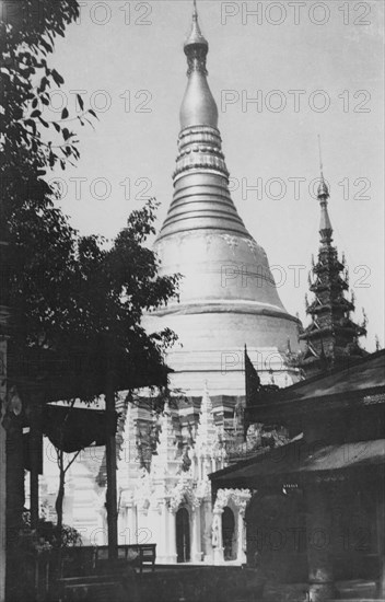 The Shwe Dagon Pagoda. View of the Shwe Dagon Pagoda with its distinctive golden dome. Rangoon (Yangon), Burma (Myanmar), circa 1925. Yangon, Yangon, Burma (Myanmar), South East Asia, Asia.
