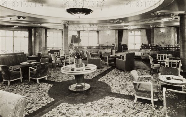 Lounge aboard S.S. Kenya. Interior of the first class lounge aboard S.S. Kenya, a passenger liner that entered service in 1951, operating from London to East Africa. Location unknown, circa 1952.