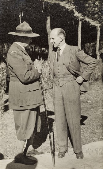Sir Rennie meets General Shea. Sir Gilbert McCall Rennie (right), the Governor of Northern Rhodesia, meets with General Sir John Stuart MacKenzie Shea at an annual boy scout jamboree. Nkana-Kitwe, Northern Rhodesia (Zambia), 1952. Nkana-Kitwe, Copperbelt, Zambia, Southern Africa, Africa.