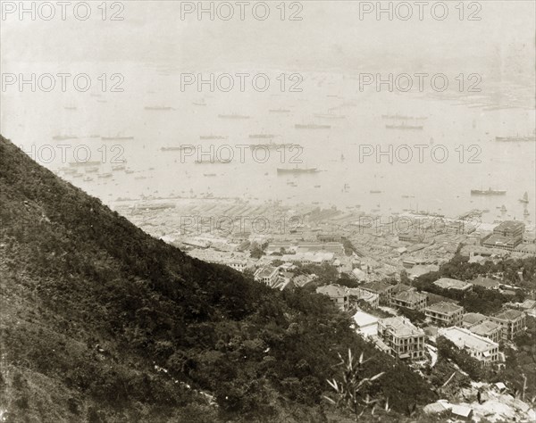 The central and western front of Hong Kong harbour. View over the central and western front of Hong Kong harbour, looking north towards Kowloon. An original caption points out the Hong Kong Hotel in the bottom right-hand corner. Hong Kong, China, 1905. Hong Kong, Hong Kong, China, People's Republic of, Eastern Asia, Asia.