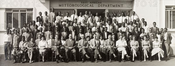 East African Meteorological Department. Staff of the East African Meteorological Department pose for a group portrait outside their offices. Nairobi, Kenya, circa 1960. Nairobi, Nairobi Area, Kenya, Eastern Africa, Africa.
