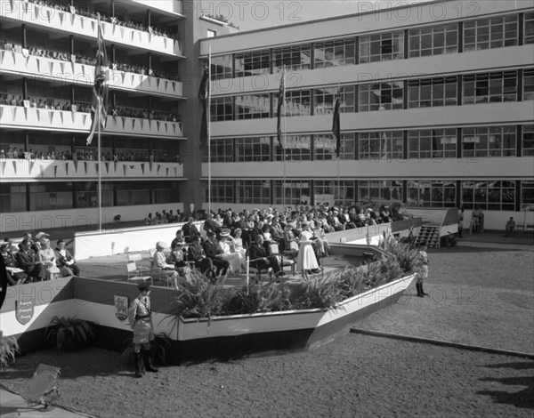Opening ceremony of the Royal Technical College. Onlookers line the balconies as Princess Margaret gives a speech from a podium at the opening ceremony of the Royal Technical College. Nairobi, Kenya, 23 October 1956. Nairobi, Nairobi Area, Kenya, Eastern Africa, Africa.