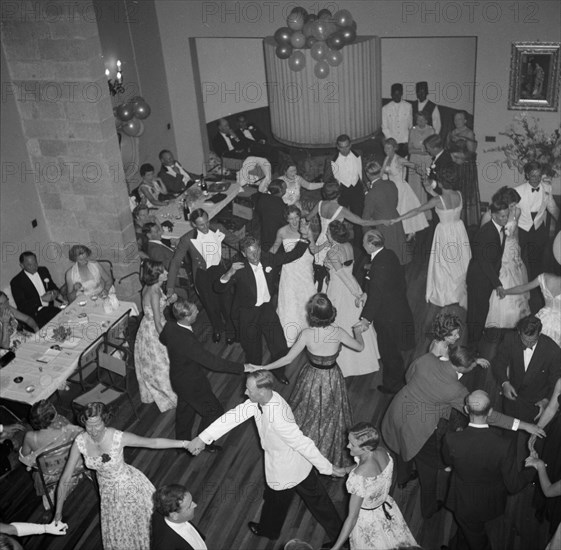 Dancing the 'Eightsome Reel'. European party guests fill the dancefloor to dance the 'Eightsome Reel' at the Limuru hunt ball. Limuru, Kenya, 27 October 1956. Limuru, Central (Kenya), Kenya, Eastern Africa, Africa.