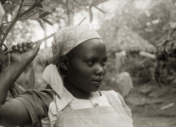 Christian Kikuyu girl. A head and shoulders portrait of an adolescent Kikuyu girl wearing a blouse and pinafore. The girl is said to be a Christian and to have refused to take the Mau Mau oath, even after Mau Mau fighters had killed her sister for refusing to cooperate. Kenya, circa 1953. Kenya, Eastern Africa, Africa.