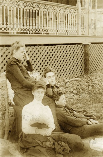 The Brodribbs at 'Nundora', Australia. Members of the Brodribb family relax, looking pensive, beside the veranda of the family house 'Nundora'. Toowoomba, Australia, circa 1908. Toowoomba, Queensland, Australia, Australia, Oceania.